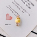 Macro detail of yellow cactus alloy pendant with pink flower and crystals on white card - Potted Rhinestone Cactus Style (KP2571-3#)