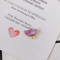 Macro detail of a purple faceted semi-circle gemstone pendant with gold-plated connectors - Light Purple