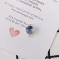 Close-up of gold-plated faceted blue crystal pendant with double loops for DIY jewelry - Blue