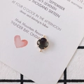Macro view of cushion-cut grey crystal pendant with gold plating and double loops for DIY jewelry - Black