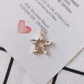 Detailed view of gold flower pendant with pink and white crystals and dual metal loops - White (2#)
