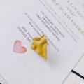 Detail of mustard yellow irregular crinkled stud earring with a matte textured finish - Yellow