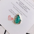 Close-up of irregular green resin teardrop pendant with gold-plated metal edge detailing - Dark Green (2#)