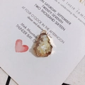 Detail showing irregular white druzy stone pendant with gold edge on elegant card - Cream