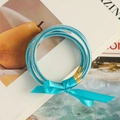 Himmelblaue Glitzer-Gelee-Armbänder im Set mit Schleife und Gold-Metallverschluss - Blau