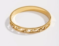 Star-shaped gold bangle featuring hollow star patterns and sparkling white crystals - Gold
