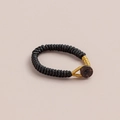 Handcrafted black Vajra knot braided ring with gold rope loops and a dark coconut button - 1 Piece / Black