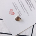 Macro view of smoky quartz fan-shaped crystal pendant with gold alloy edging for DIY jewelry - Black and Gray