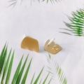Detailed view of matte gold irregular geometric earrings on a tropical leaf background - Irregular Geometric Style (2#)