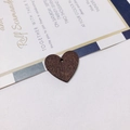 Dark brown heart-shaped wooden charm with natural grain and hanging hole for DIY crafts - Brown