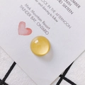 Detail of yellow round cat eye stone bead for DIY jewelry making on white card - Light Yellow