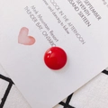 Glossy red resin semicircular cabochon accessory on a heart-patterned gift card - Red