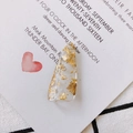 Macro shot of resin drop pendant with gold foil flakes on a minimalist white card - Long Water Drop Shape Gold Foil Style (4#)