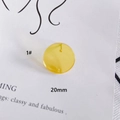 Detailed view of 20mm translucent yellow resin round charm for DIY jewelry earrings - 20mm / Yellow