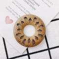Close-up of geometric hollow wooden earring pendant with natural brown textures - Hollow Round (3#)
