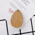 Macro view of teardrop-shaped wooden earring pendants with natural grain and pre-drilled holes - Solid Waterdrop (2#)