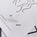 Macro view of 18mm translucent matte round earring accessory on a minimalist card - Matte Milk White (9#)