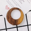 Macro detail of round wooden earring pendant featuring natural wood grain texture and hole - Solid Round Disk (5#)