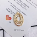 Detailed view of layered oval gold pendant with handmade texture and 33x22x1.5mm size - Layered Overlapping Oval Style (5#)