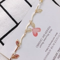 Elegant gold plated wave chain accessory with hollow leaf pendants on a grid background - Hollow Leaf Style (1# Gold)