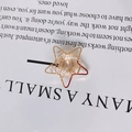 Ciondolo a stella placcato oro KC con zircone di cristallo trasparente avvolto in filo - Stella