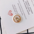 Detail of round gold-plated pendant with pink resin and natural shell inlay for DIY jewelry - Light Pink