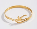 Bracciale rigido dorato Occhio di Horus con finitura opaca su sfondo grigio chiaro - Oro