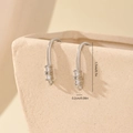 Detailed macro view of silver DIY earring hooks with 1.7cm vertical cubic zirconia stones - White Gold 3-Stone Vertical Style (MYYX00587)
