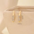 Macro detail of gold C-shaped earrings with micro-set cubic zirconia and size dimensions - Gold Double Row Pave Style (MYYX00573)