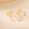 Macro detail of gold bow earrings with heart pendants and 2.2cm size measurement - Gold Bowknot Heart Style (MYYX00653)