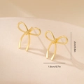 Detail view of gold bow knot earrings showing dimensions of 2cm by 1.8cm on display - Gold Rounded Bowknot Style (MYLHD00004)