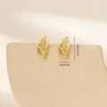 Macro detail of leaf-shaped gold-plated earrings with zircon accents and hanging loop - Gold (MYYX00619(e-E26))