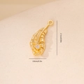 Macro view of a gold feather pendant with zircon inlay showing 2.1cm length dimension - Gold Feather Style (MYYX00647)