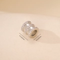 Detailed macro view of 0.7cm silver spacer bead with triple-row cubic zirconia inlay - 1PCS / Pave Rhinestone Cylindrical Bead (MYYX00534) / White Gold