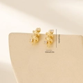 Macro detail of leaf-shaped gold plated earrings with zircon accents and size markers - Double Spiral Intertwined Style (MYYX00602(e-I25)) / Gold (MYYX00602(e-I25))