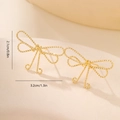 Macro detail of gold bow earrings featuring an intricate twisted rope texture and size specs - Gold Twisted Bowknot Style (MYLHD00002)