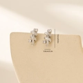 Detail view of silver twisted rope stud earrings with sparkling white cubic zirconia stones - Double Spiral Intertwined Style (MYYX00602(e-I25)) / Platinum (MYYX00602(e-I25))