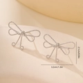 Detailed size view of silver bow-shaped stud earrings featuring a textured woven design - Platinum Twisted Bowknot Style (MYLHD00002)