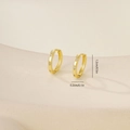 Detailed view of small gold hoop earrings with star engraving and zircon inlay - Star Engraved With Zirconia (E071305k4) / Gold
