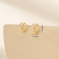 Macro detail of gold-plated geometric hoop earrings with sparkling cubic zirconia stones - Gold (MYYX00622(e-H26))
