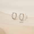 Detail view of silver hoop earrings with zircon inlay showing 1.3cm outer diameter size - Toothed Hoop Style (E071290bkb) / White Gold