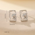 Macro shot of silver rose flower earrings in a rectangle frame with dimension measurements - Rectangular Rippled Frame Rose Style (MYYX00710(b-O25)) / White Gold