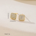 Macro detail of geometric square stud earrings with zircons measuring 0.7cm and 1.2g - Gold Square Style (MYEF1270)
