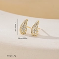 Macro shot of geometric teardrop stud earrings with gold plating and cubic zirconia - Gold Teardrop Style (MYEF1269)