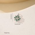 Macro shot of silver pendant with green zircon and braided texture, size 1.2cm x 0.9cm - Woven Loop Green Stone Style (MYXF0586)