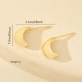 Detail shot of golden crescent stud earrings with 2.1cm length and polished metal finish - Crescent Polished Style (MYED34033) / Gold