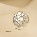 Detailed view of an oval metal pendant with sun and birds relief including size markings - White Gold / Oval Relief Style (MYPJ66035)