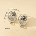 Macro detail of silver oval earrings showing irregular texture and dimensions 1.6x1.2cm - Oval Vertical Relief Stripe Style (MYED34091) / White Gold