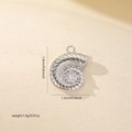 Macro detail of conch pendant with zircon stone and size dimensions 1.4cm x 1.2cm - White Gold (MYCBK3704)