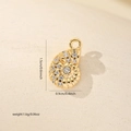 Detail view of gold conch pendant with cubic zirconia inlay showing 1.5cm x 0.9cm dimensions - Gold (MYCDNE558)
